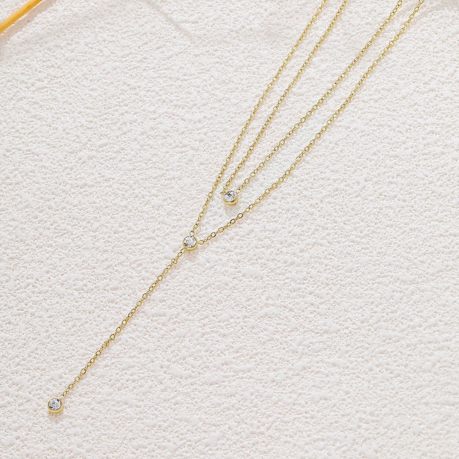 Collana a Y con doppia catena in oro e strass rotondi