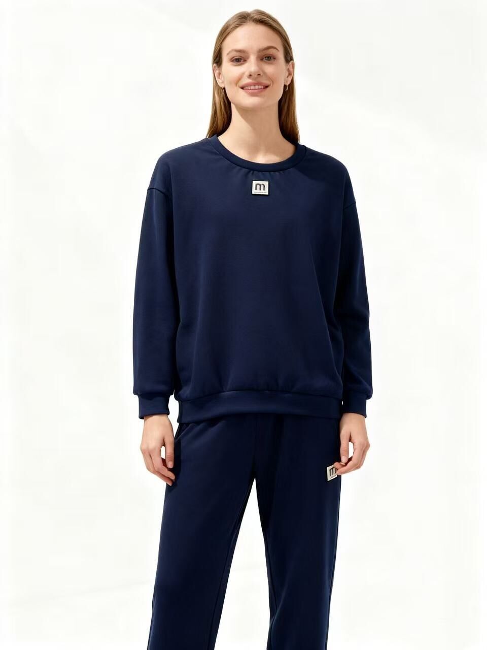 Conjunto deportivo con la letra M