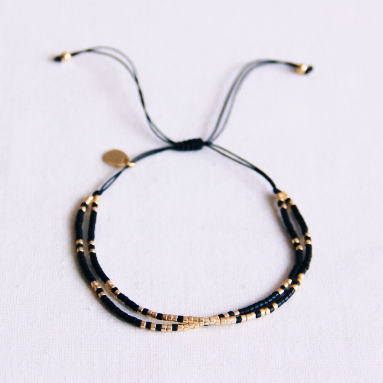 Pulsera doble Miyuki - chapada en negro/oro