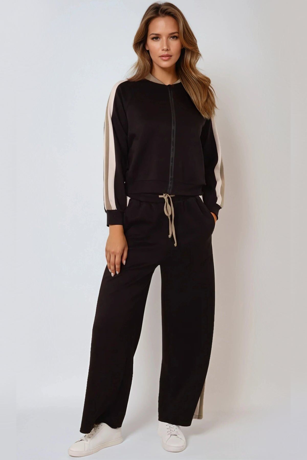 Completo bomber a righe nere e jogger