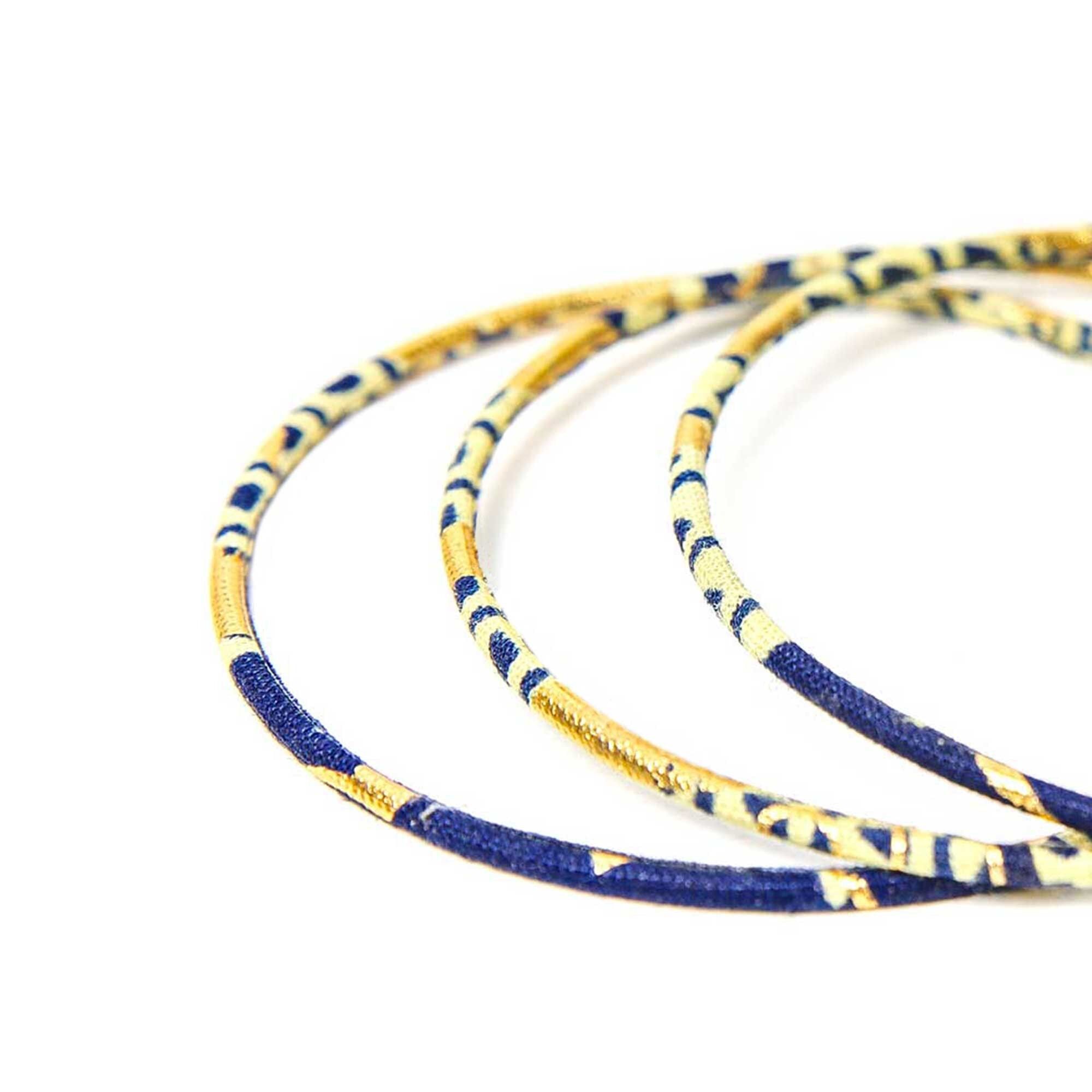 Bracciali pregiati in cera blu navy e oro