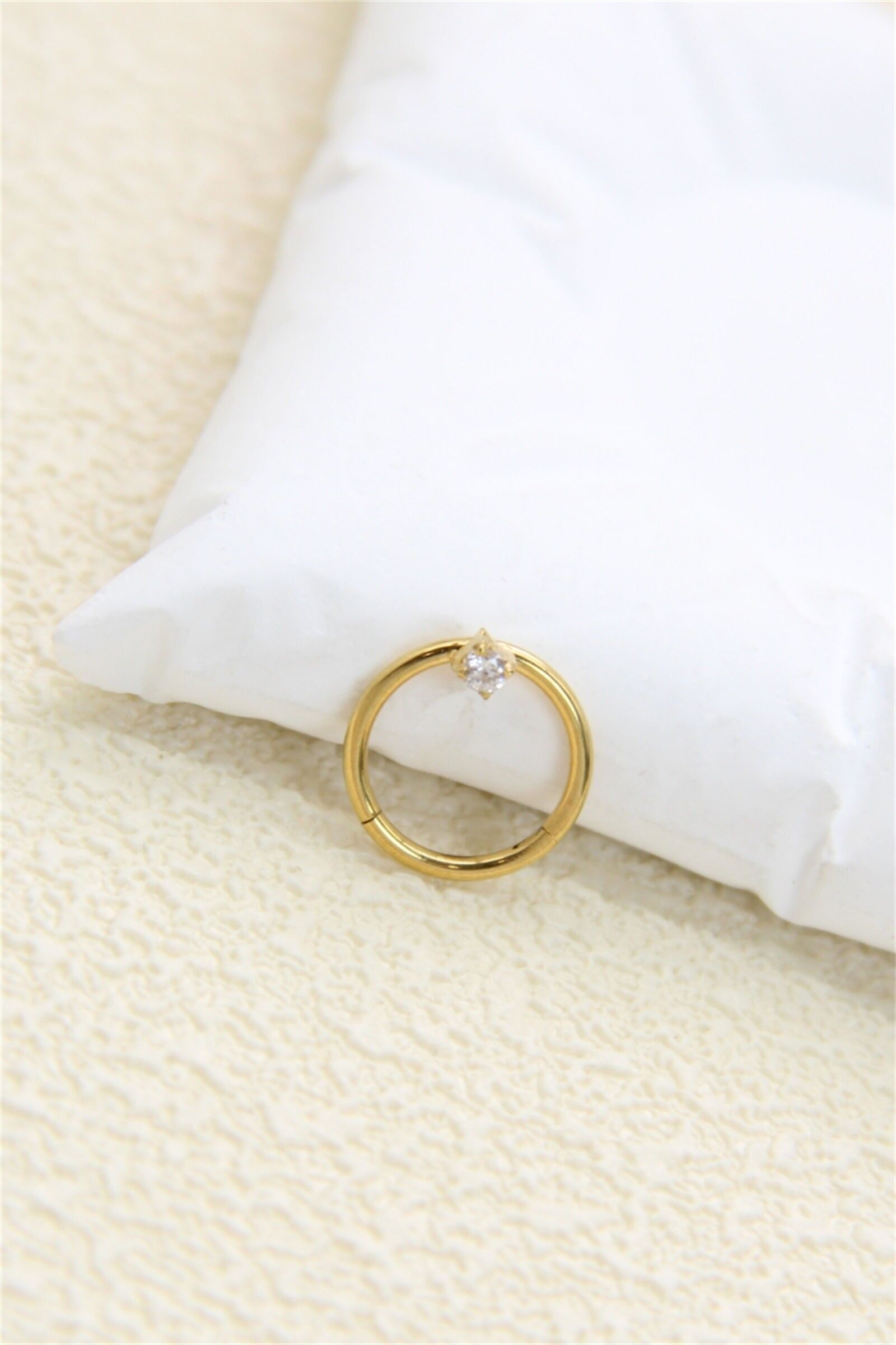 Gold-tone stainless steel ring piercing with rhinestone setting – Ear or nose piercing