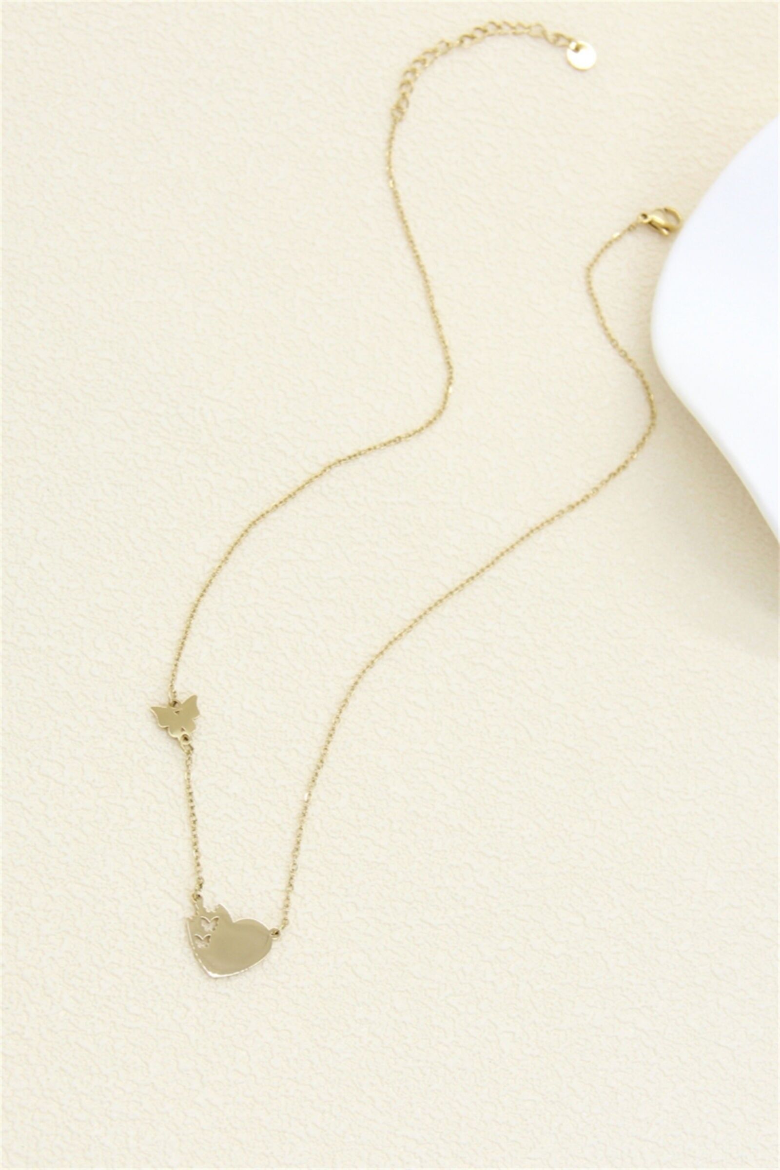 Halskette aus Edelstahl mit Herz und Schmetterling