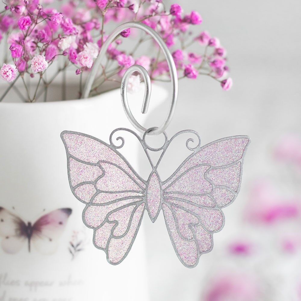 Set di 12 picchetti acchiappasole a forma di farfalla bianca in esposizione