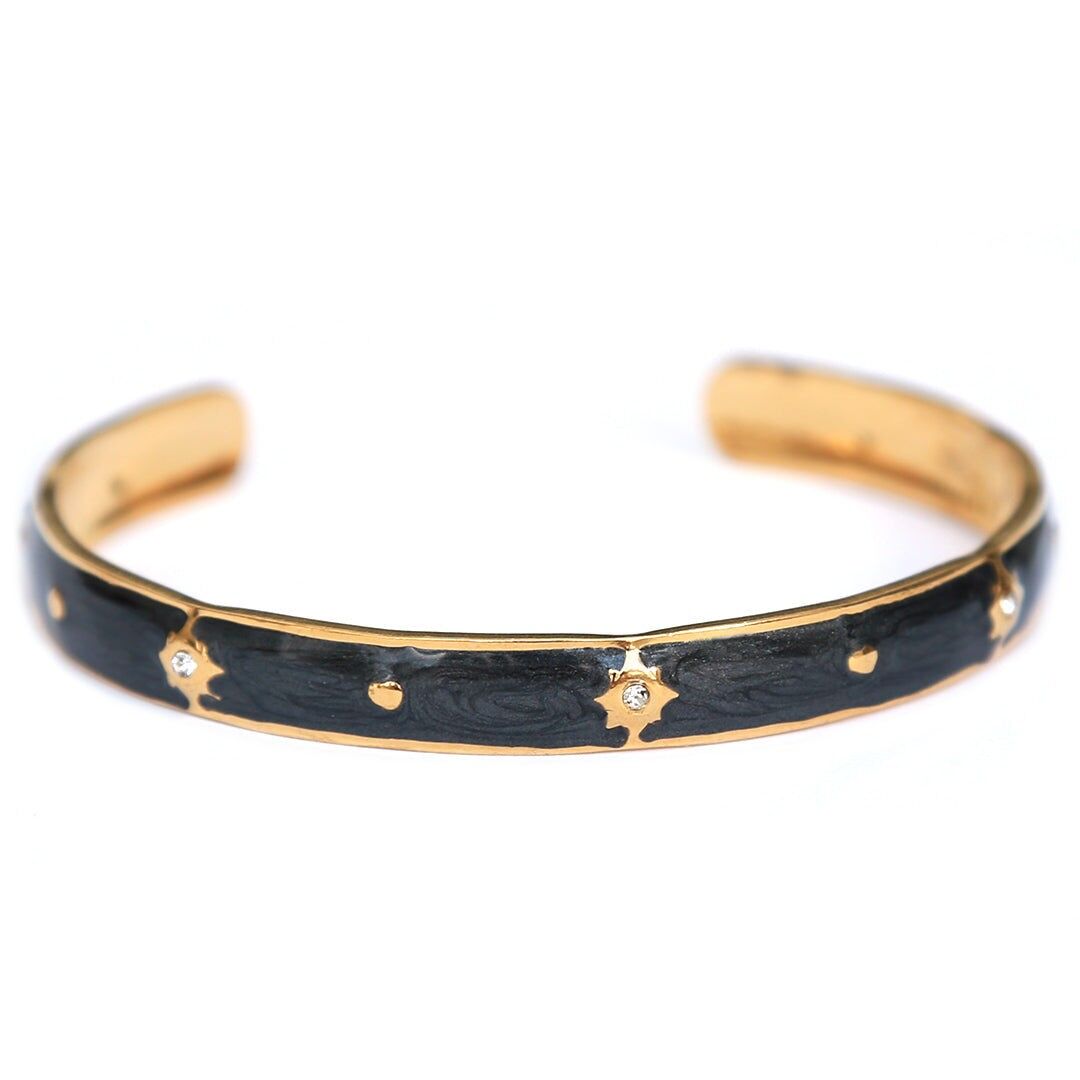 Goldene Armreifen mit Sternen, schwarz