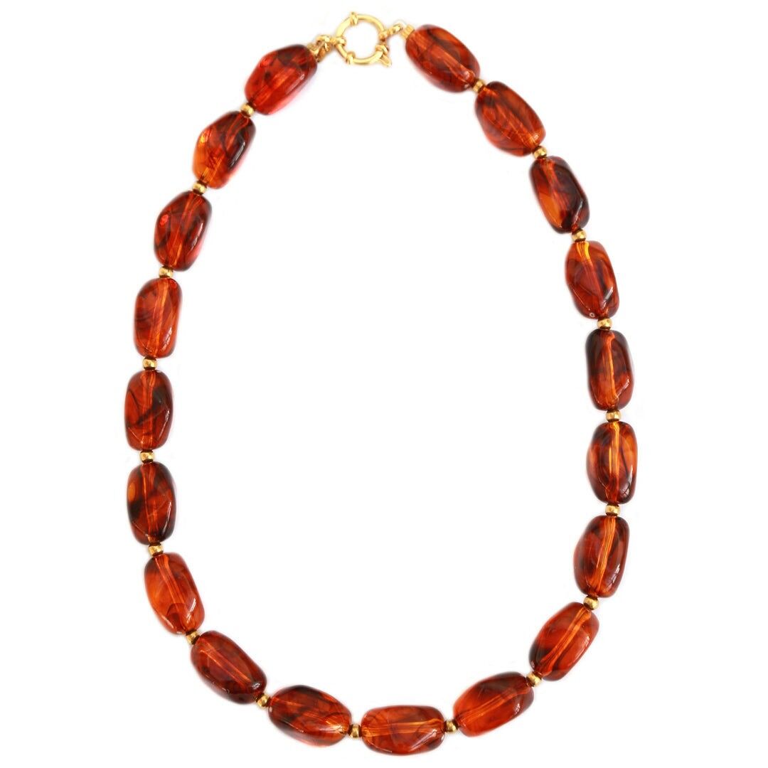 Goldene Halskette, Felsen, Schildkröte