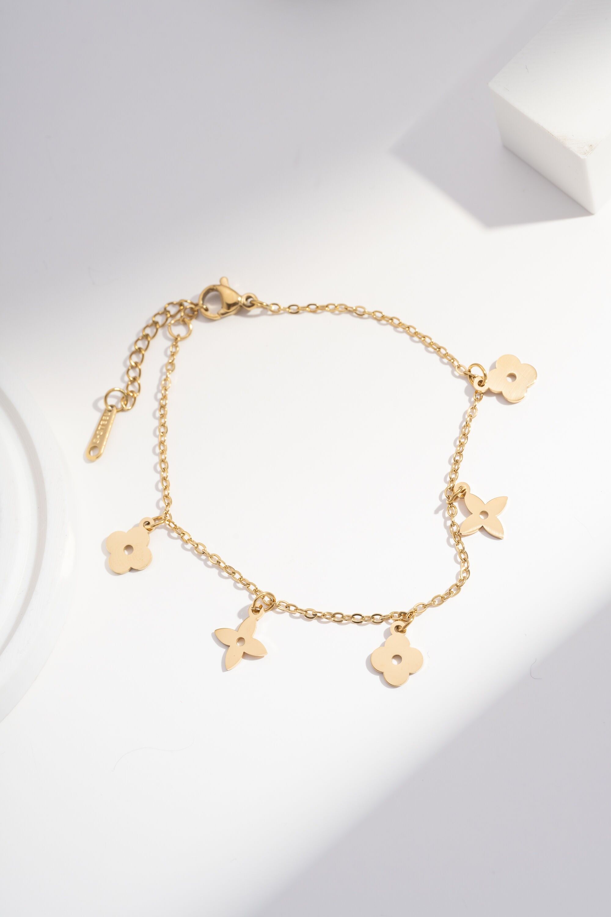 Gold Bracelet with Five Stylized Flowers on a Fine Chain
