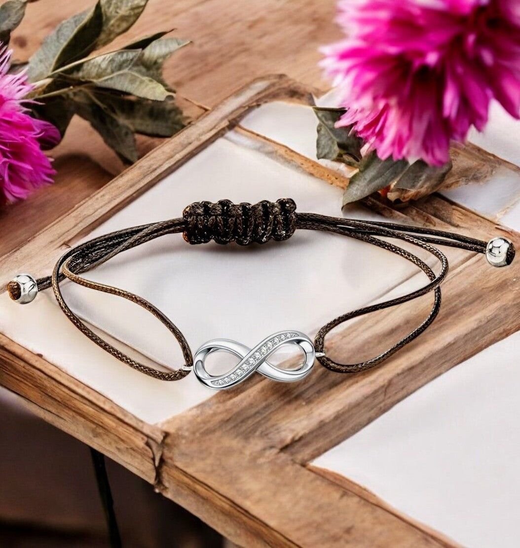 Bracciale "INFINITO" con cordino regolabile e simbolo dell'infinito in argento