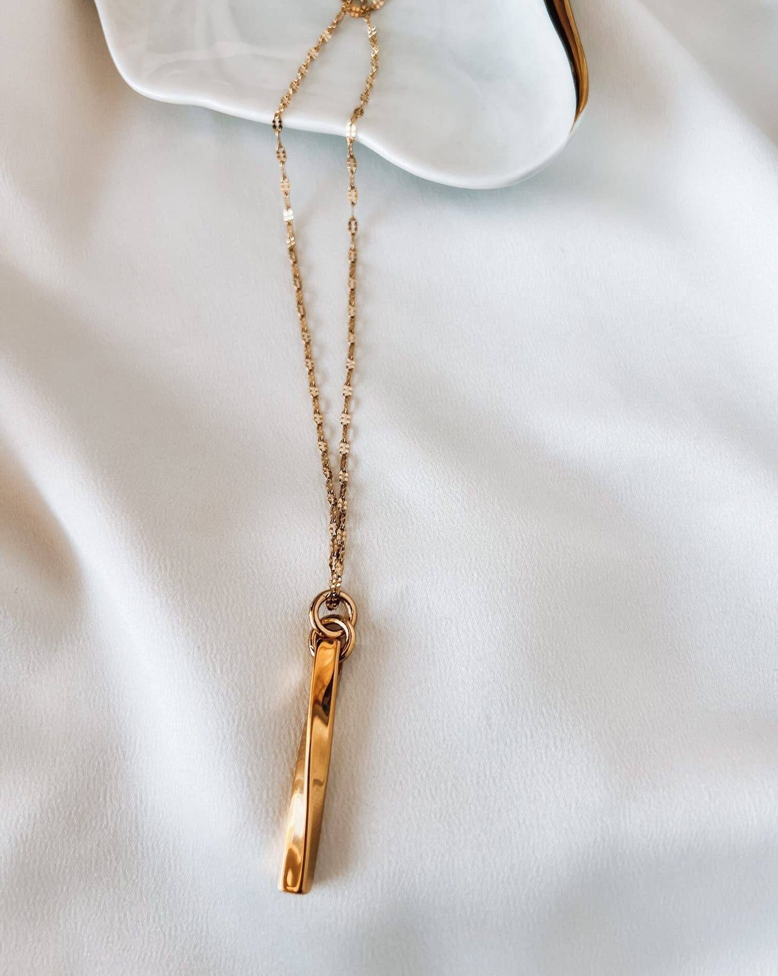 Collana lunga in oro con barra in acciaio dorato