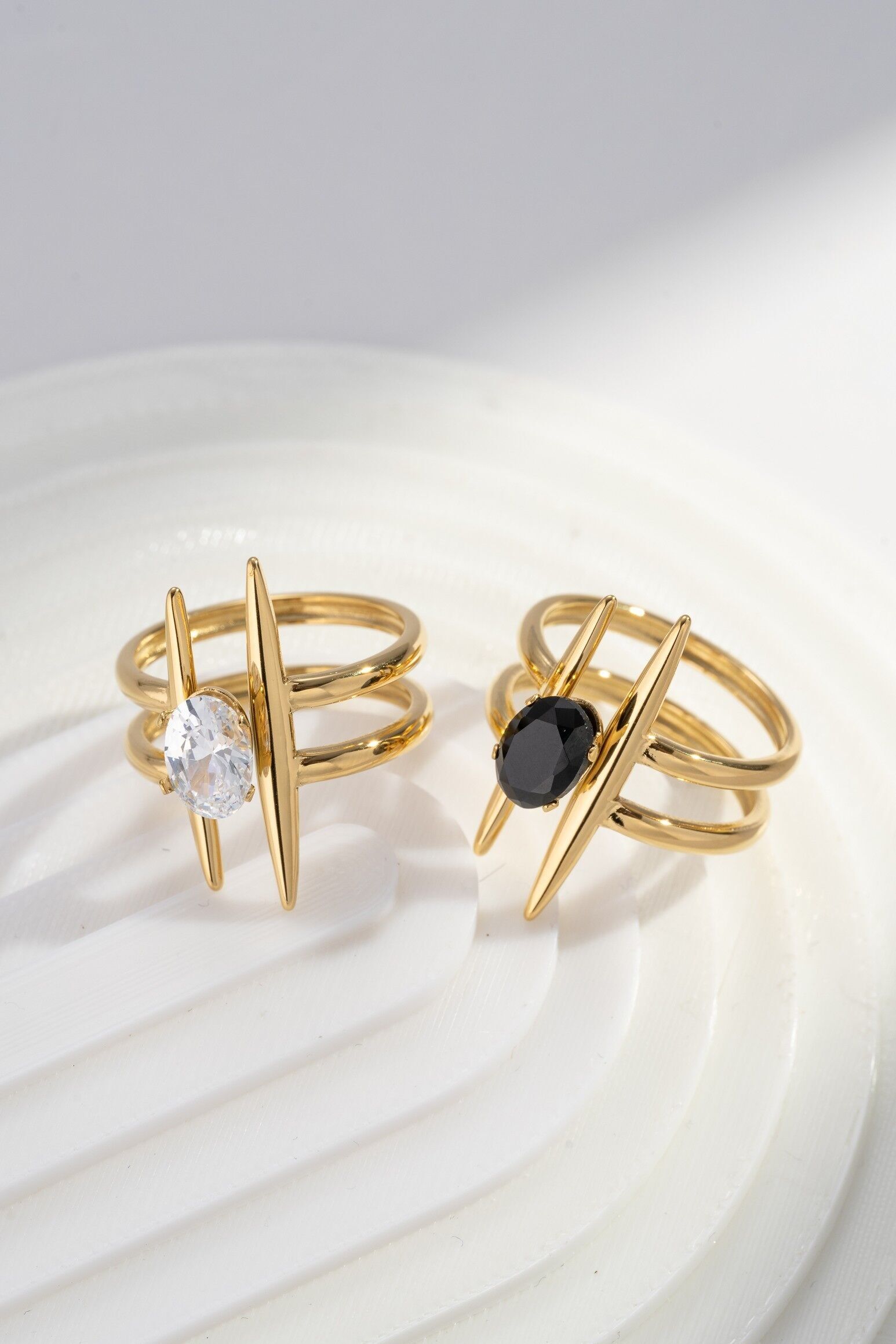 Gold-plated stainless steel ring with a sculptural center stone