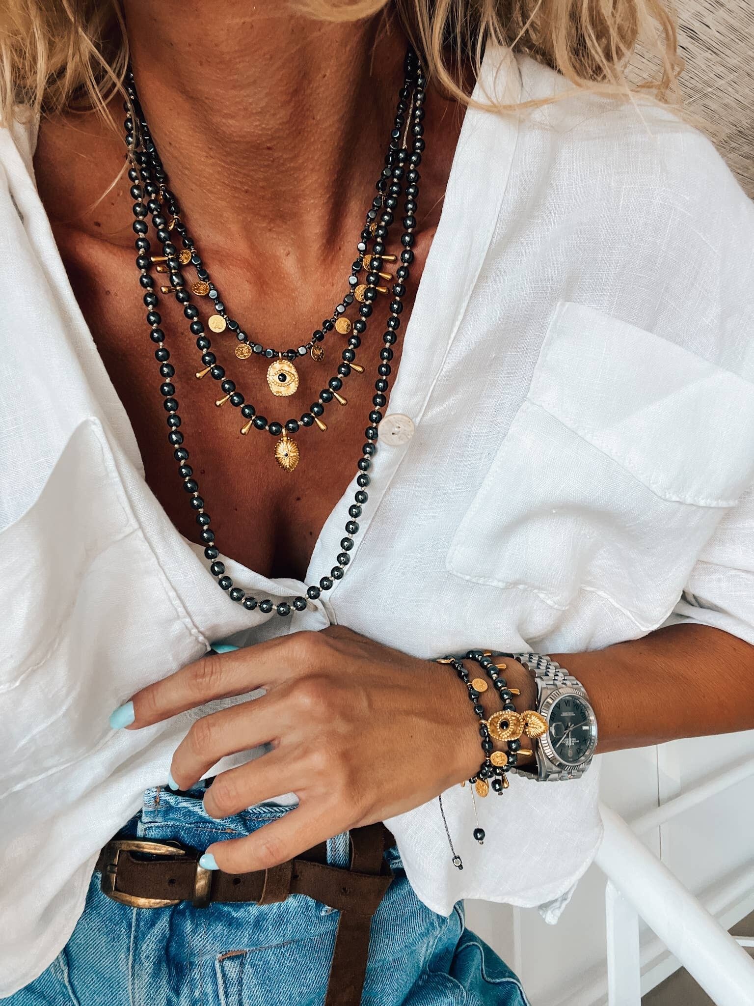 Collares de cuentas de hematita negra con dijes de ojos dorados