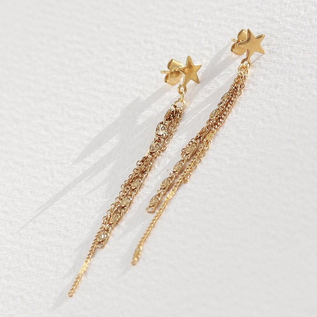 Goldener langer Sternohrring