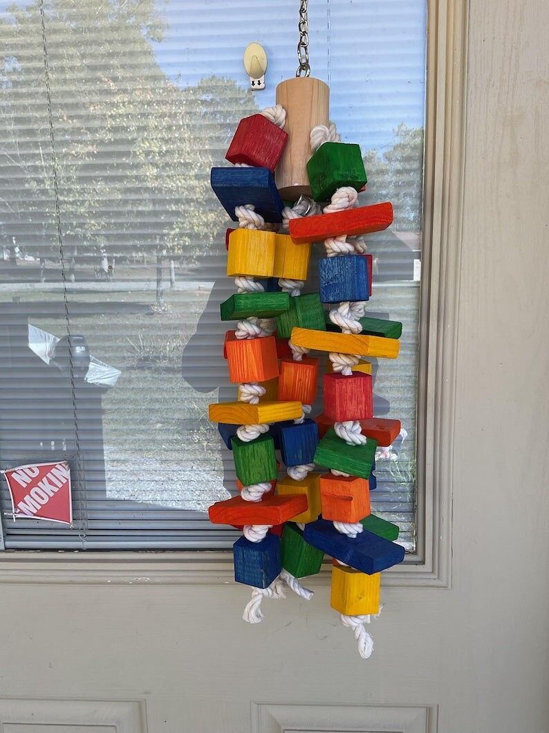 JOUET TOUR À PERROQUET