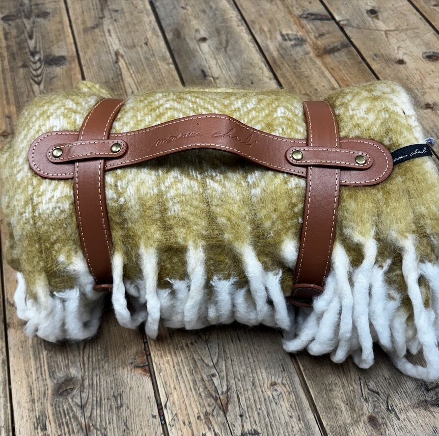 Acrylic blanket with carrying strap