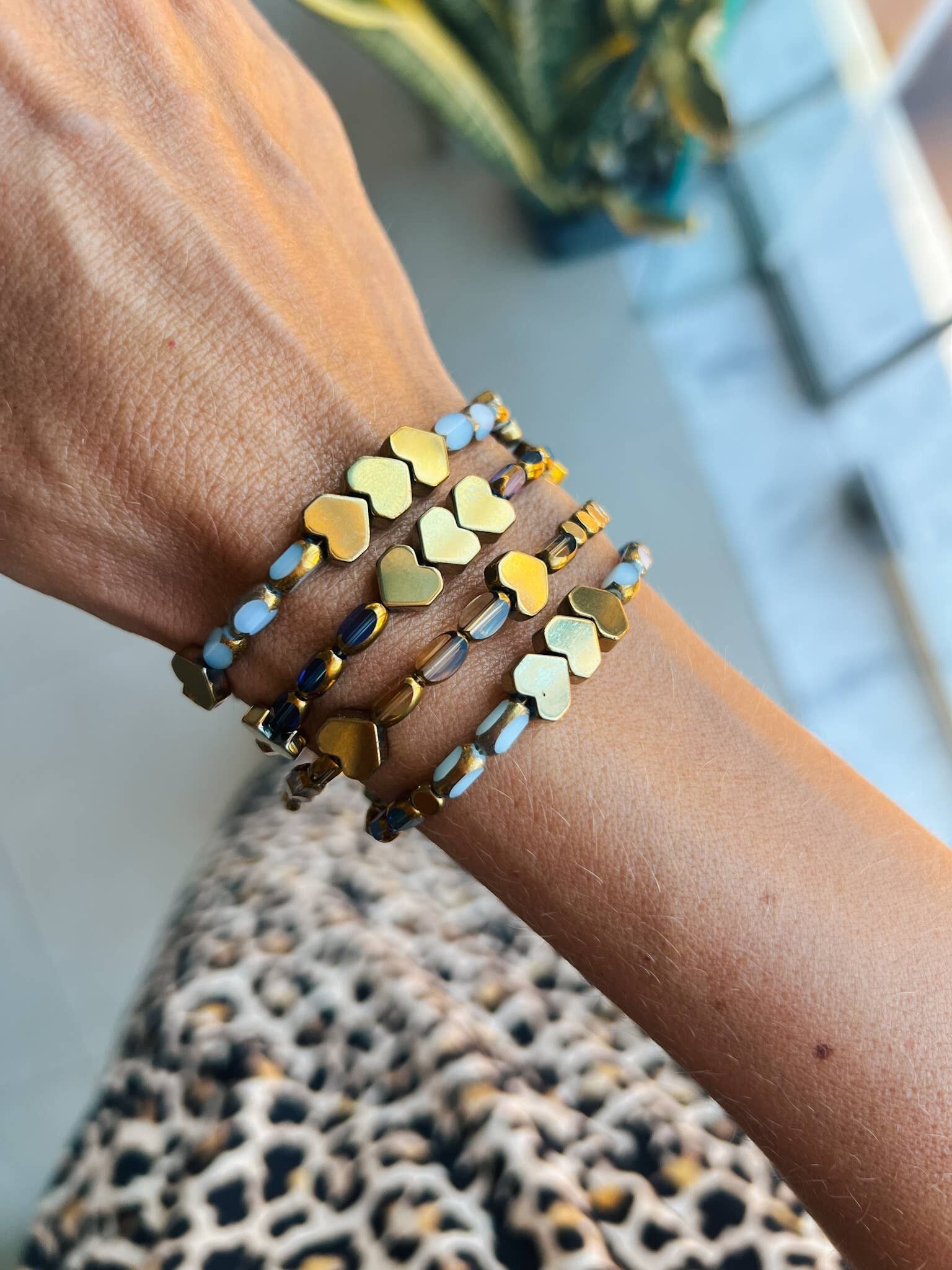 Multicolor beaded bracelets in blue, gold and ciel