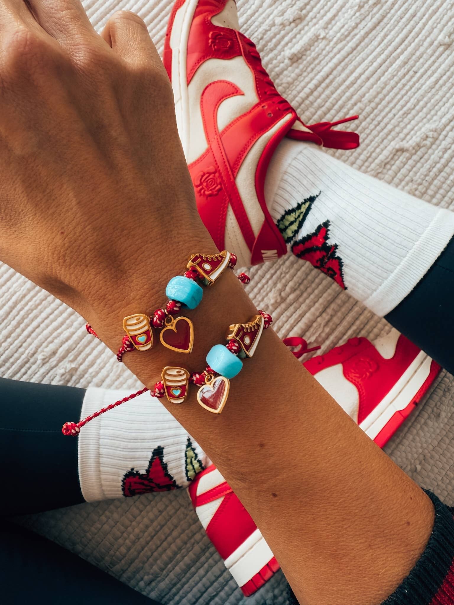 Spring bracelet with red cord and 90s charms