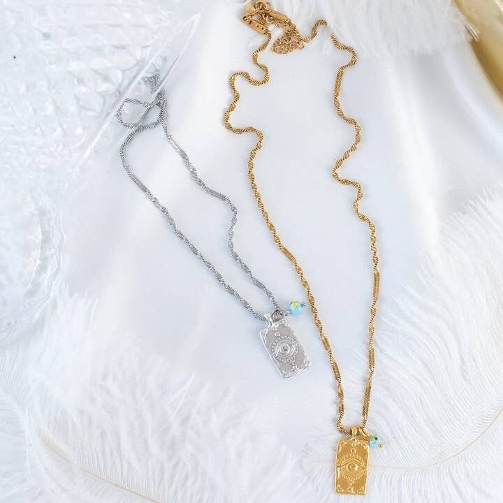 Collier avec étiquette de protection contre le mauvais œil