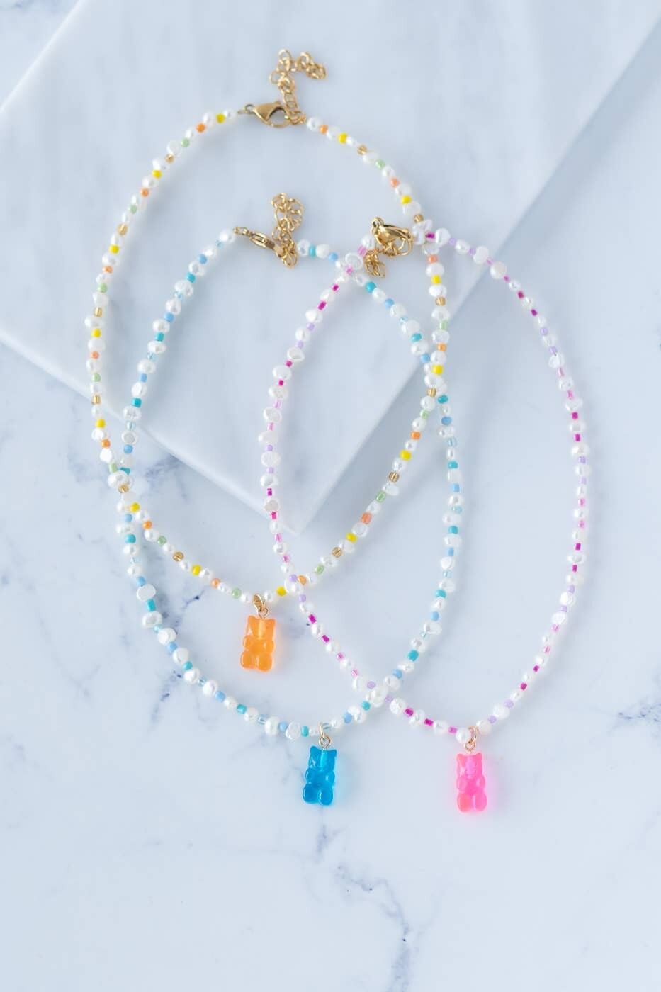Pearl choker necklace with gummy bear charm