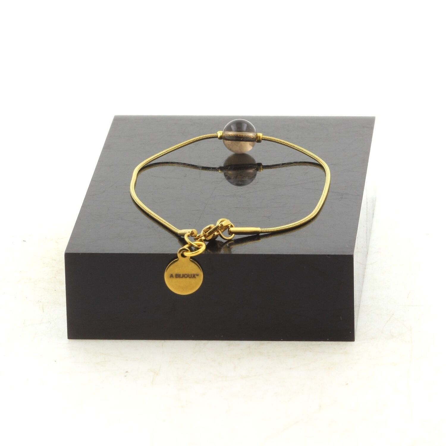 Bracciale in acciaio inossidabile placcato oro con 1 perla di quarzo fumé da 8 mm proveniente dal Brasile. Fatto in Francia