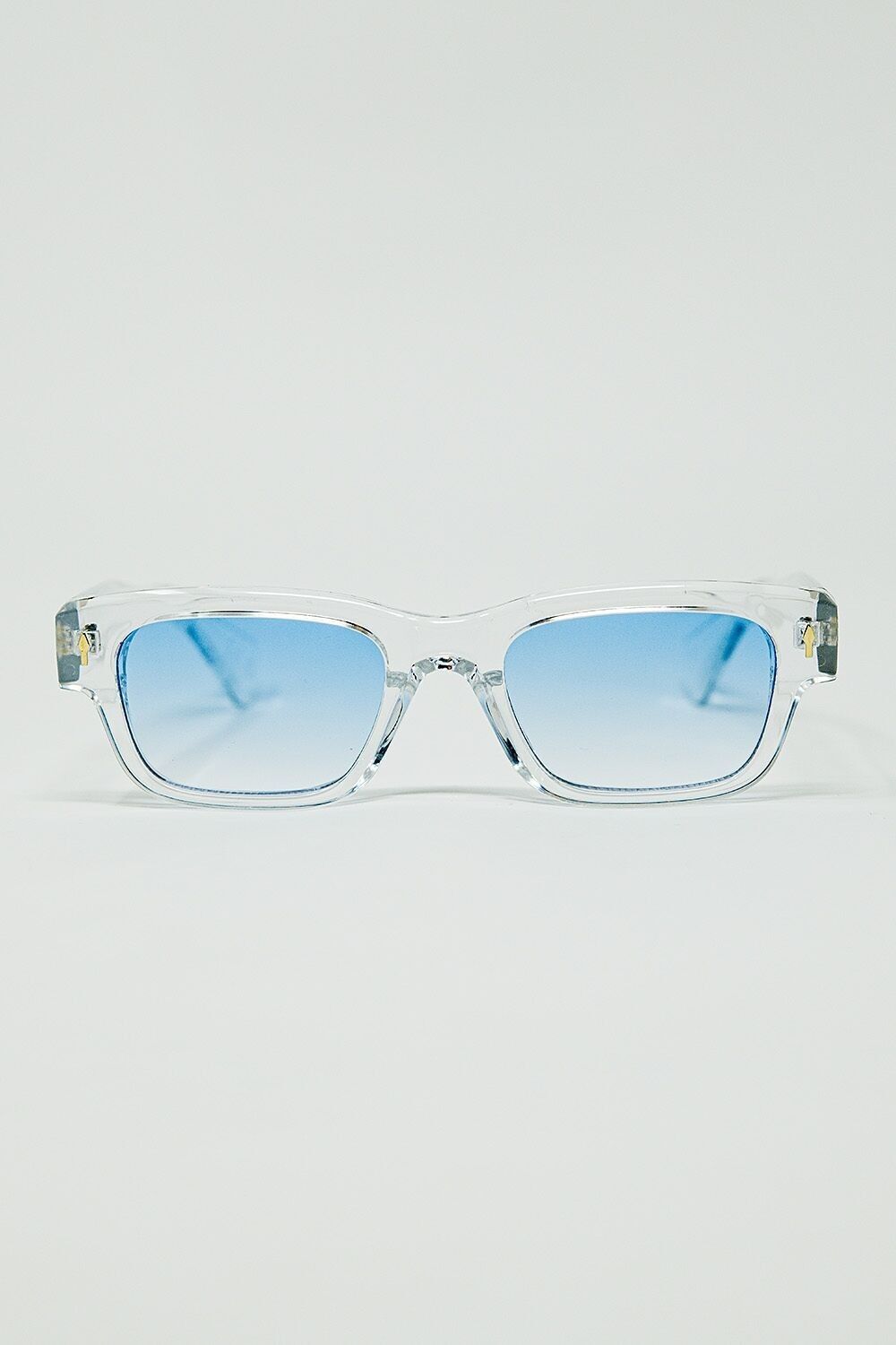 Occhiali da sole bianchi traslucidi con lenti ovali azzurre