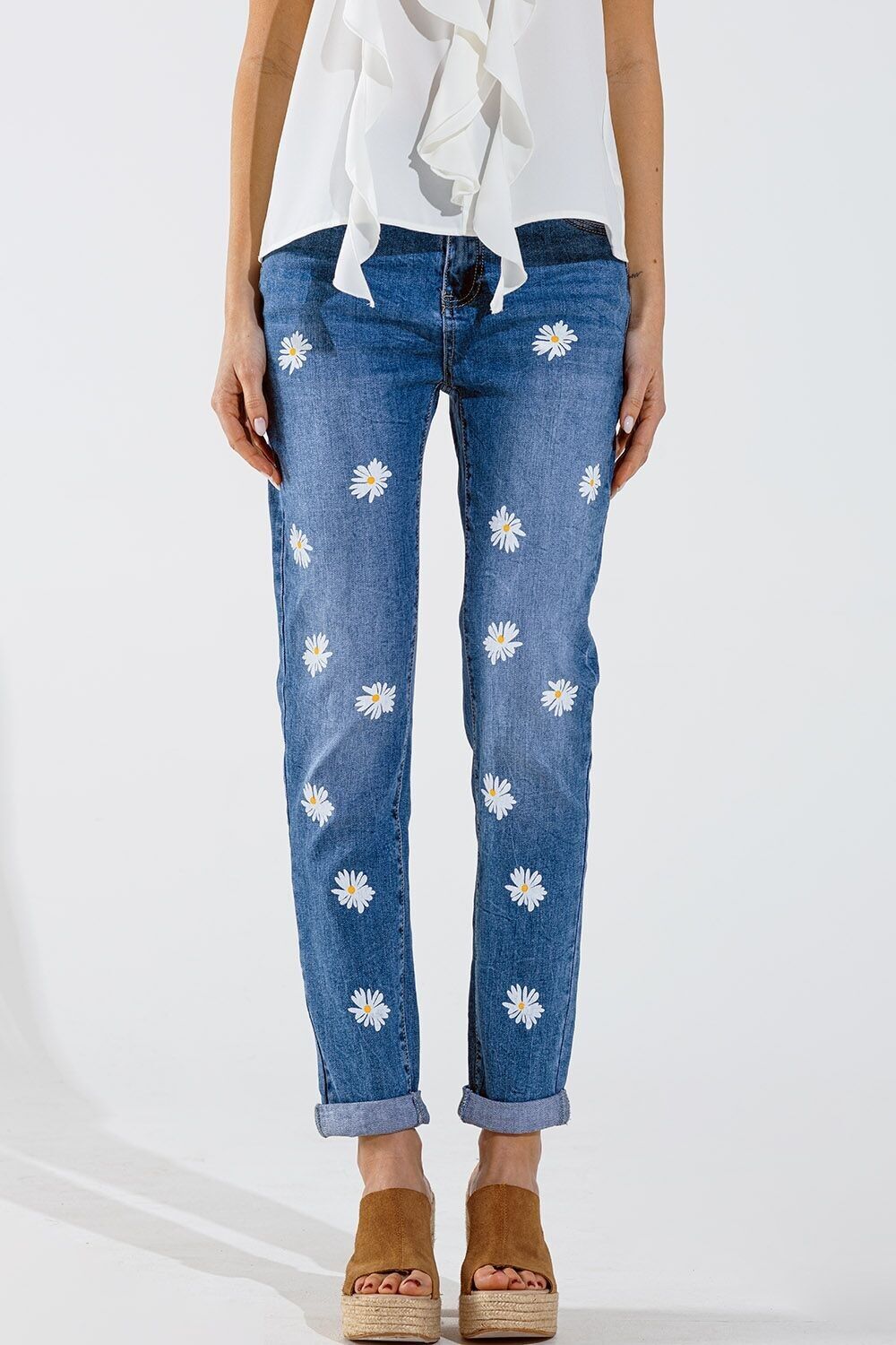 Jeans skinny con margherite bianche stampate a lavaggio medio