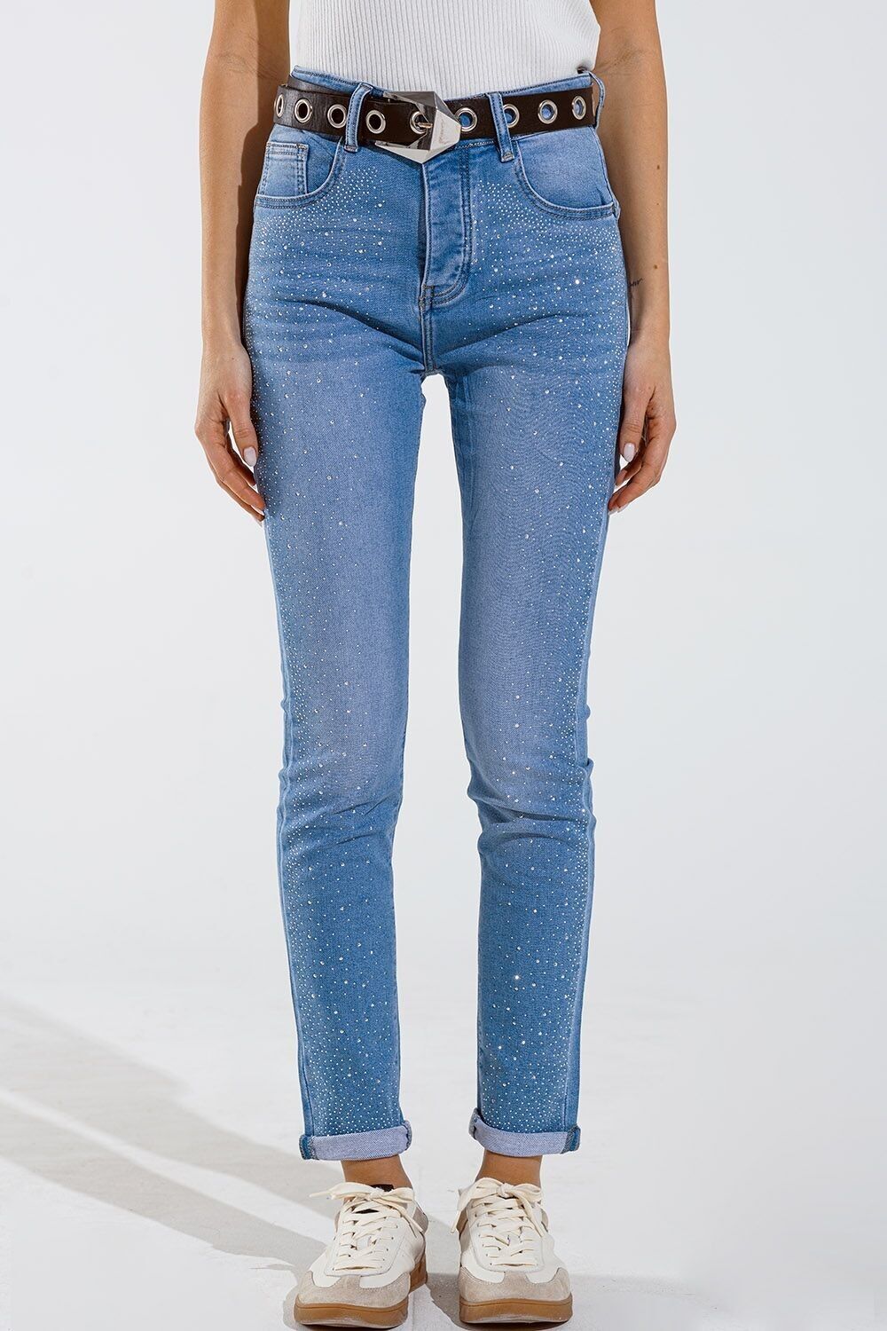 Jeans skinny in blu lavato con strass su tutto il davanti