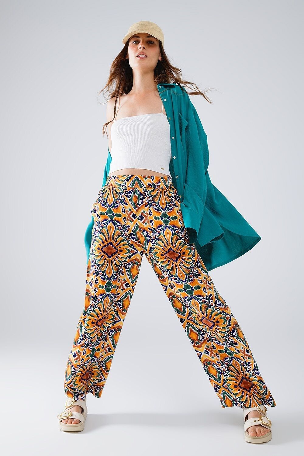 Pantaloni multicolori con stampa floreale in arancione e blu