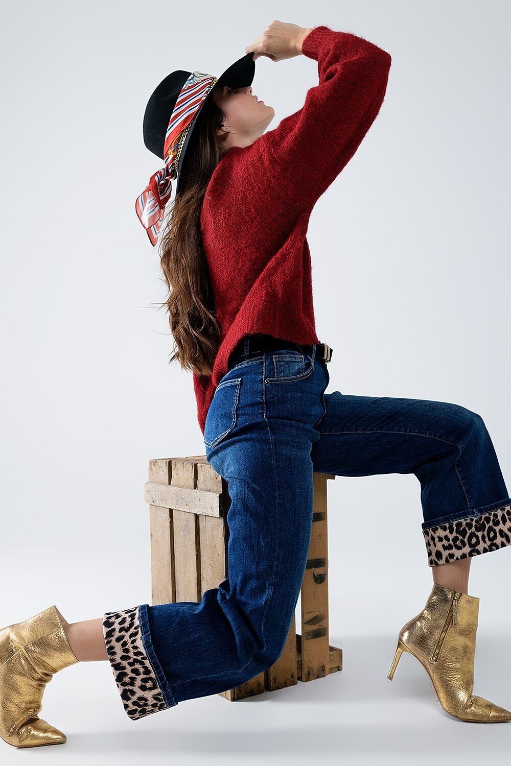 Jeans a gamba larga con striscia leopardata sul fondo