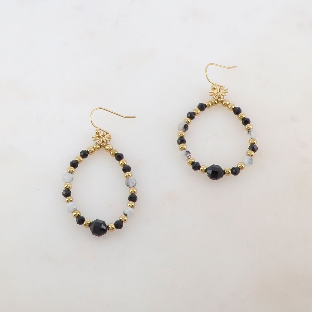 B.O-shaped crochet hook with sun tassel, steel beads, natural stones