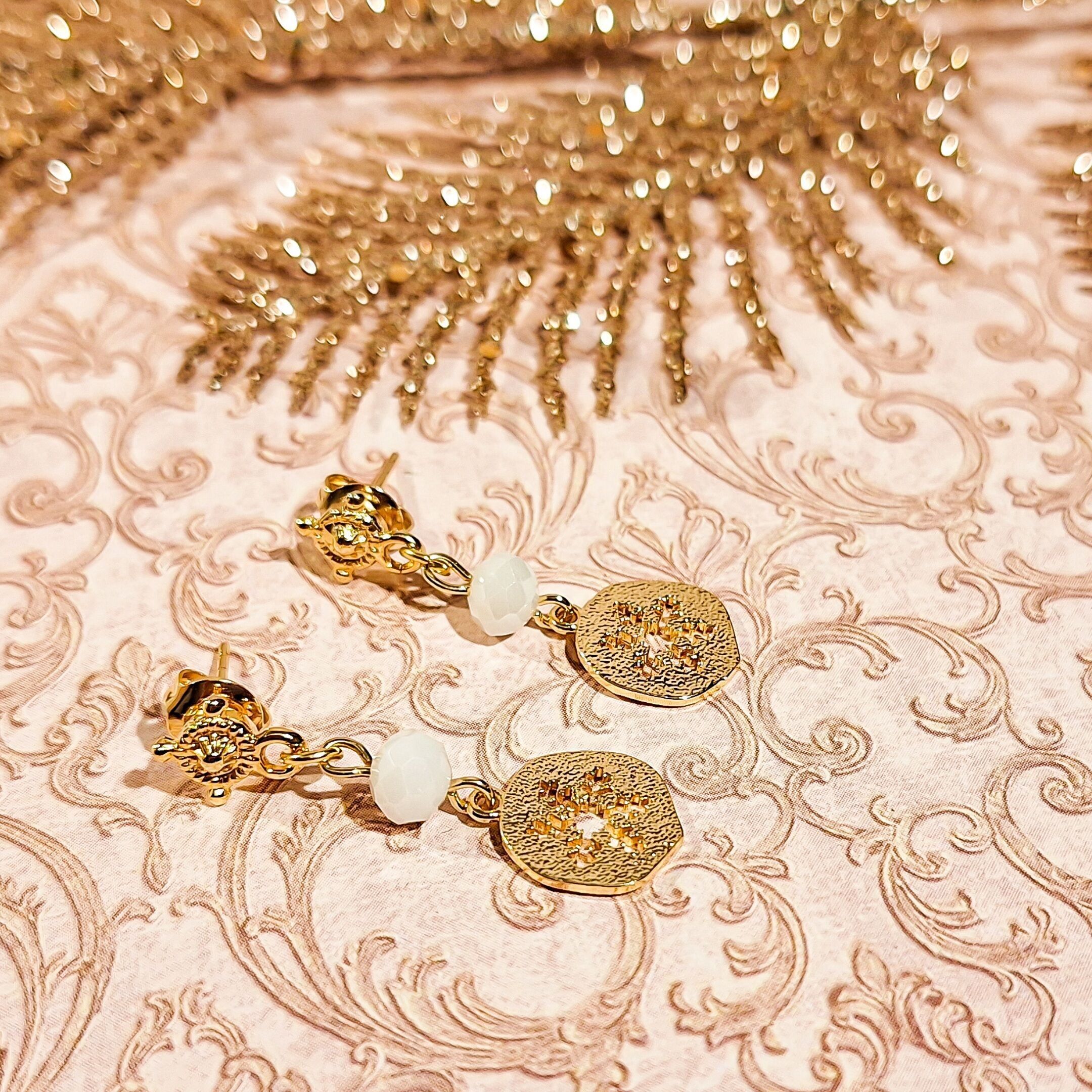 Gold-tone pearl snowflake pendant earrings