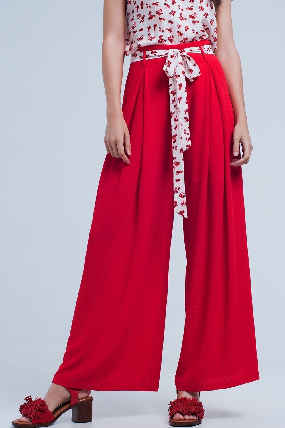 Red pants with floral belt