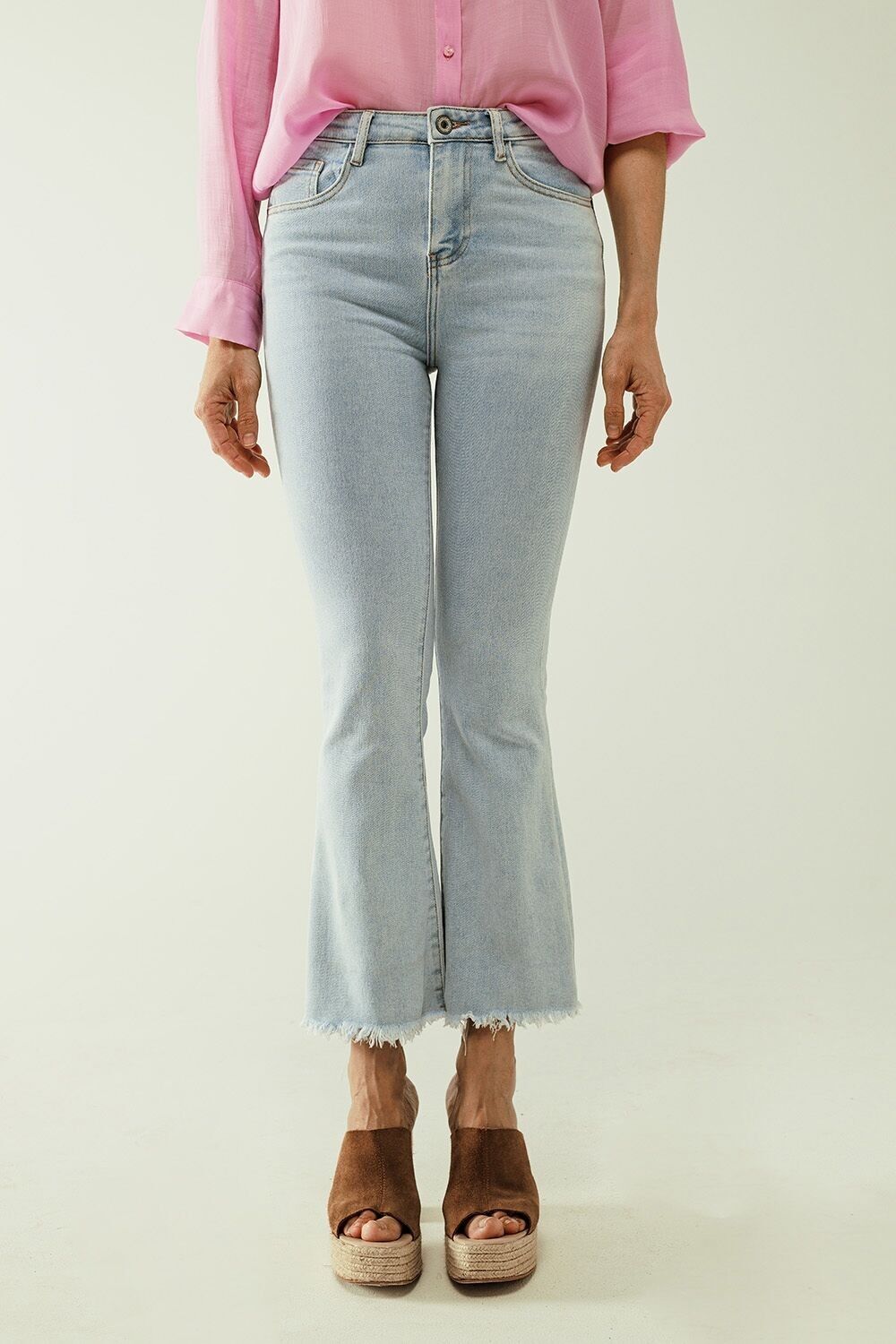 Flared light blue jeans with five pockets and seamless finish