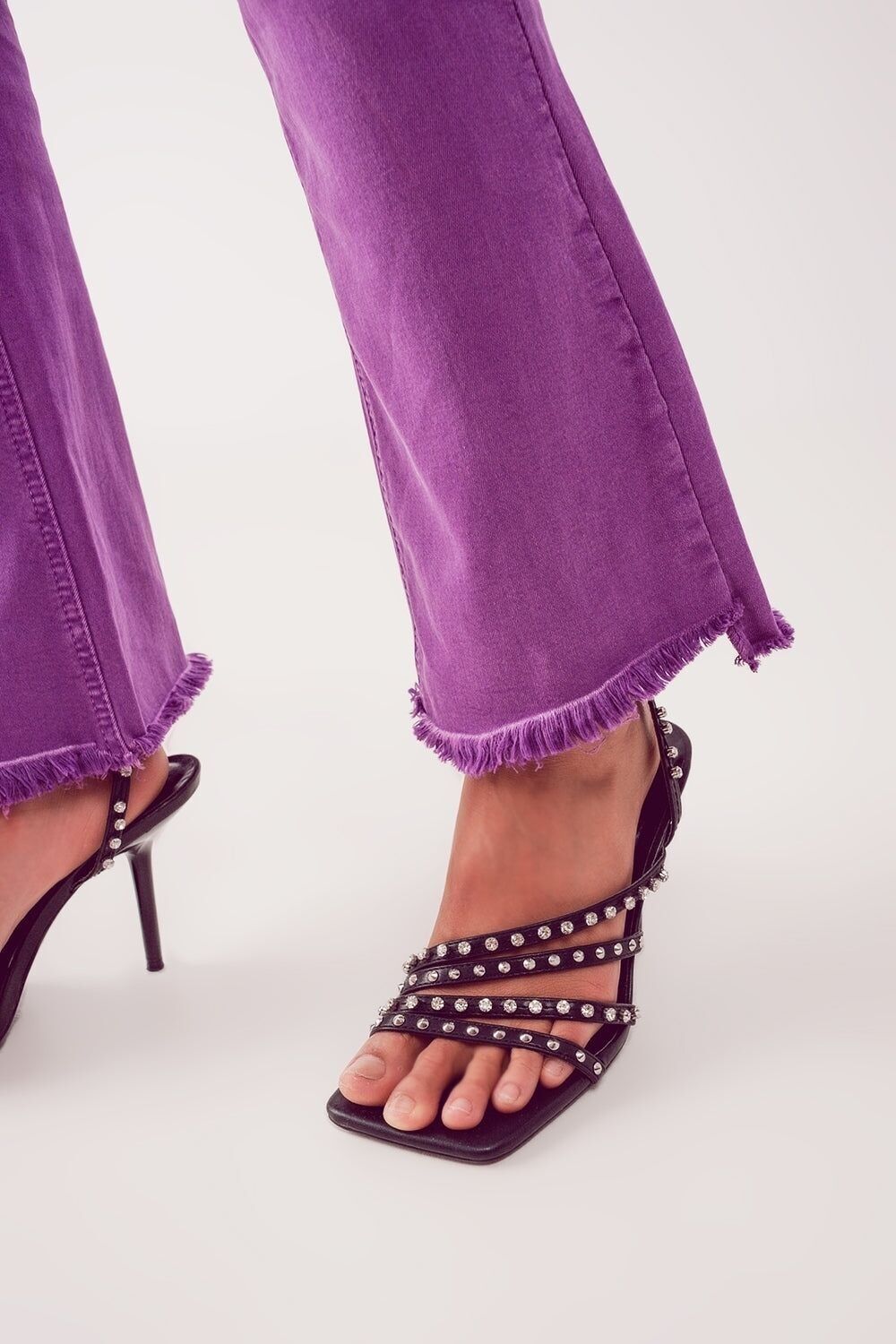 Flare jeans with raw hem edge in purple