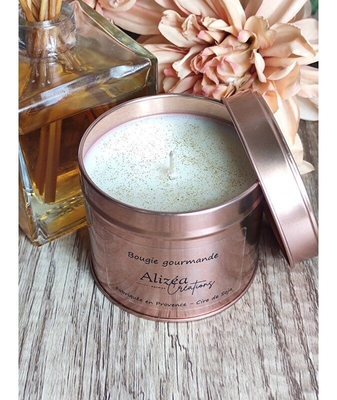 Poured candle in a pink lidded jar