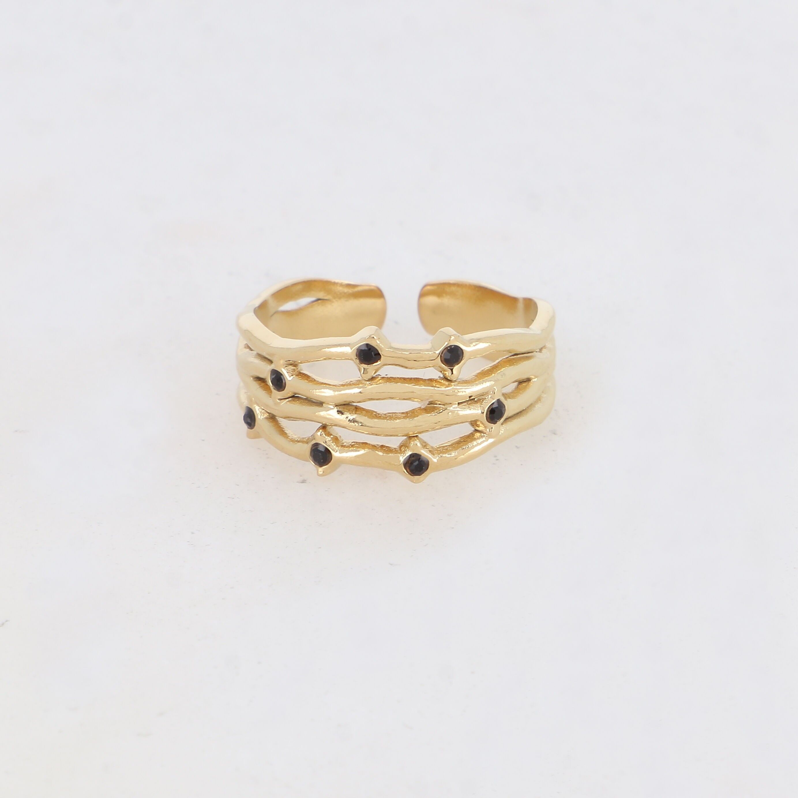 Four-row ring in a graphic shape with 7 rhinestones