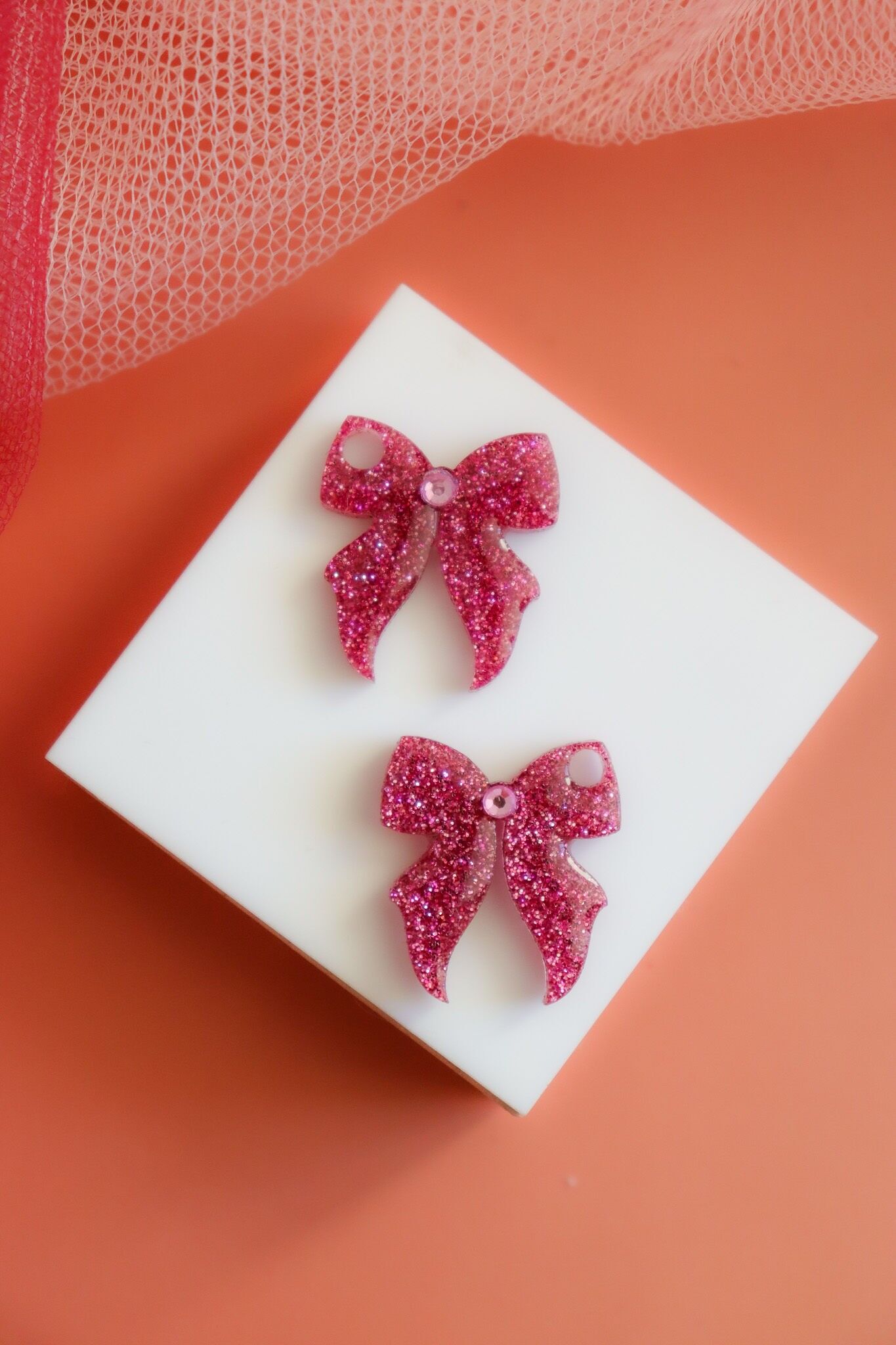 Dunkelrosa Schleifen-Creolen