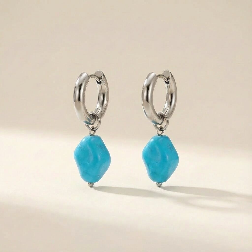 Steel hoop earrings with baby blue bead in silver