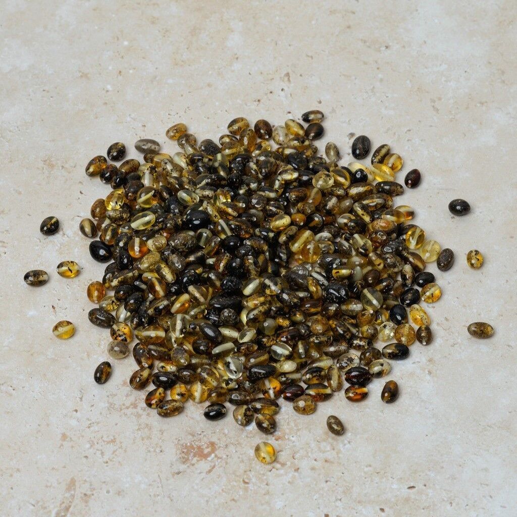 Perle di ambra forate ovali verdi 50 gr (~400 pz)