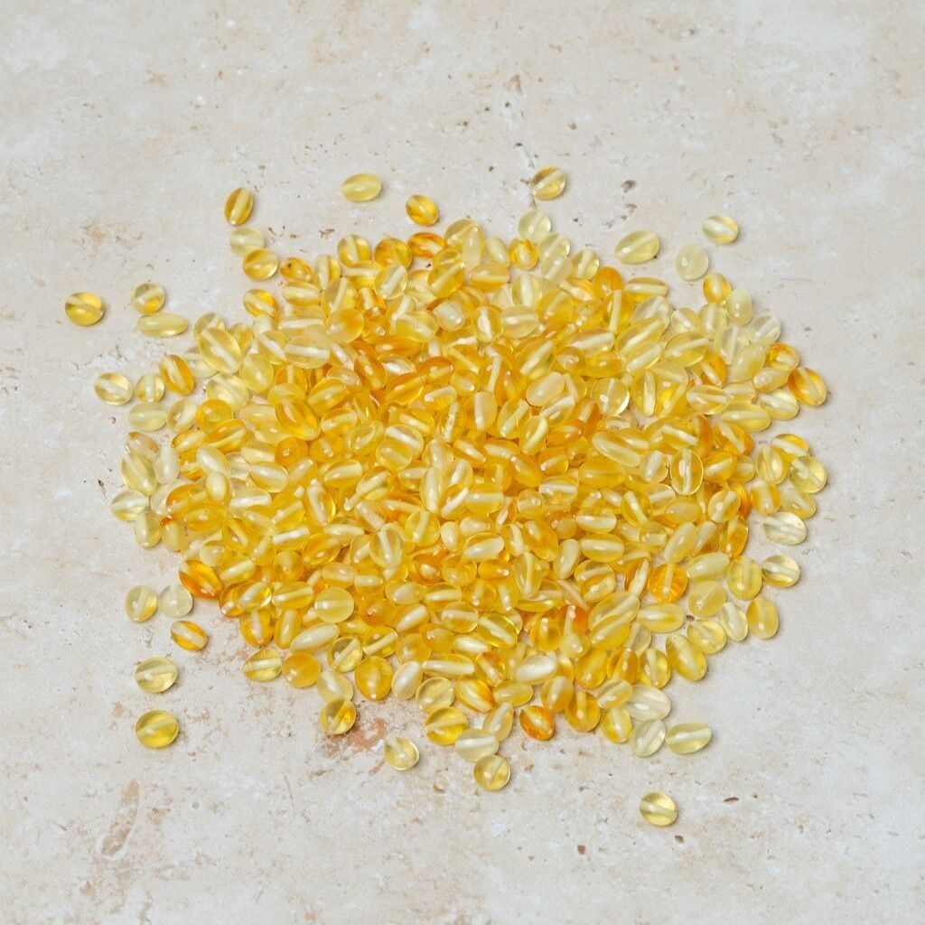 Perle di ambra forate ovali color limone 50 gr (~400 pz)