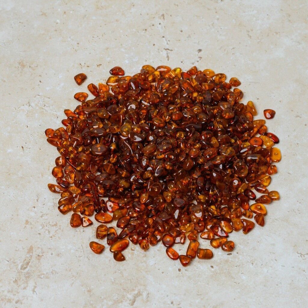 Perline di ambra forate cognac 50 gr (~600 pz)