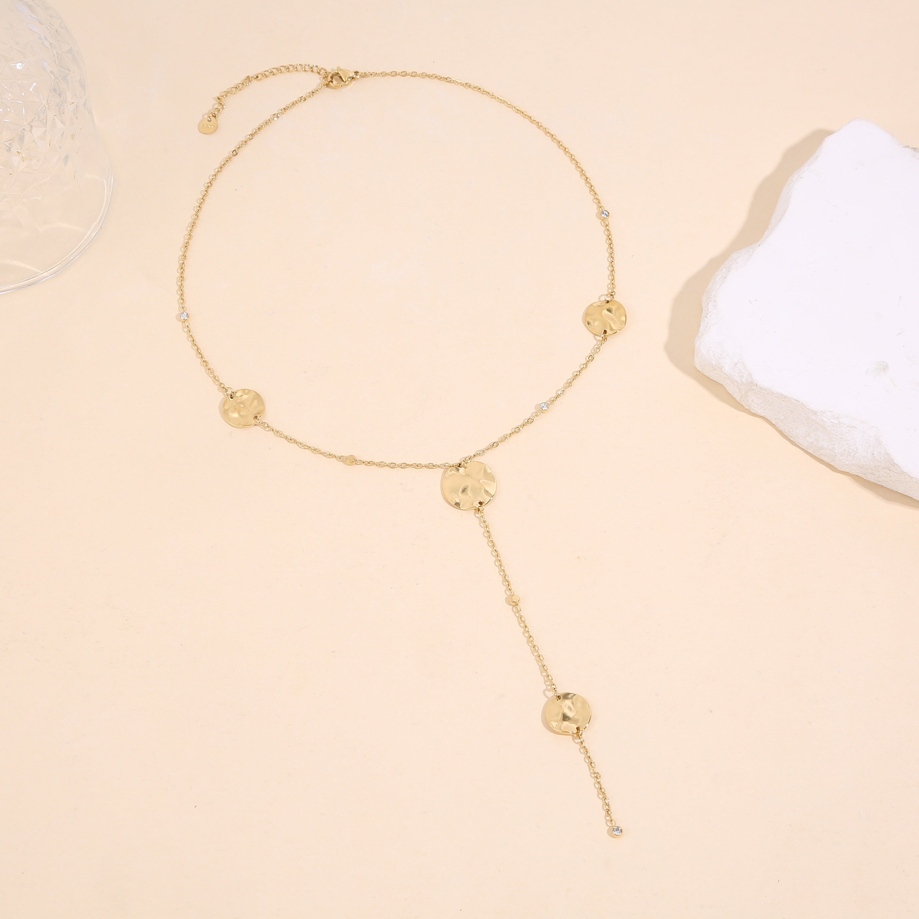 Gold-tone Y-shaped necklace with a fine chain adorned with 4 hammered circles