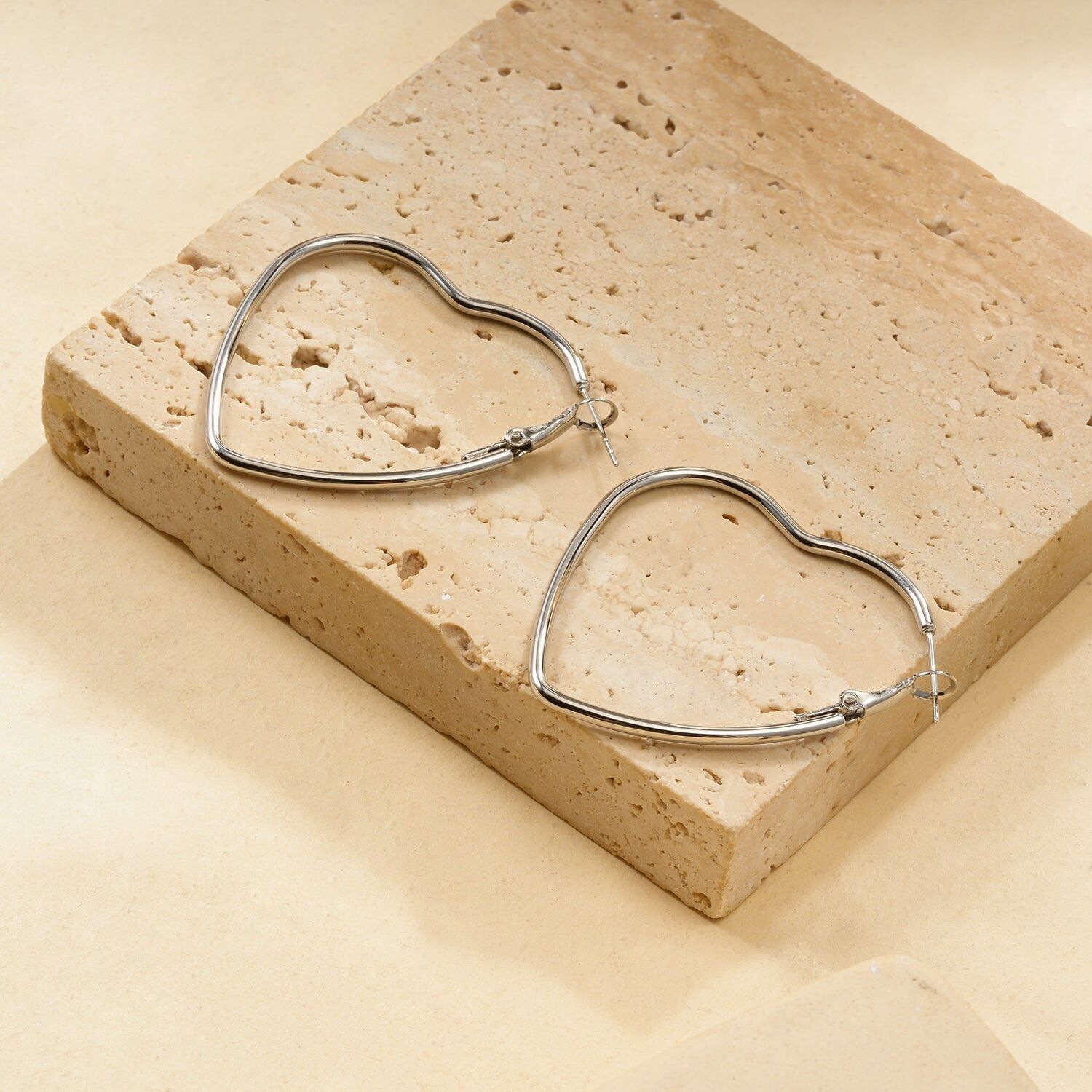 Silver heart-shaped hoop earrings