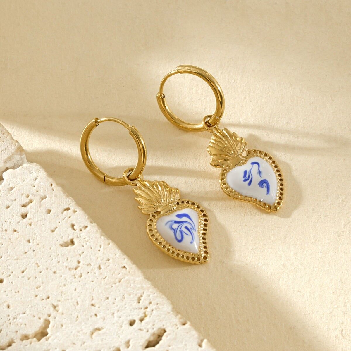 Gold-plated hoop earrings with porcelain enamel heart pendants