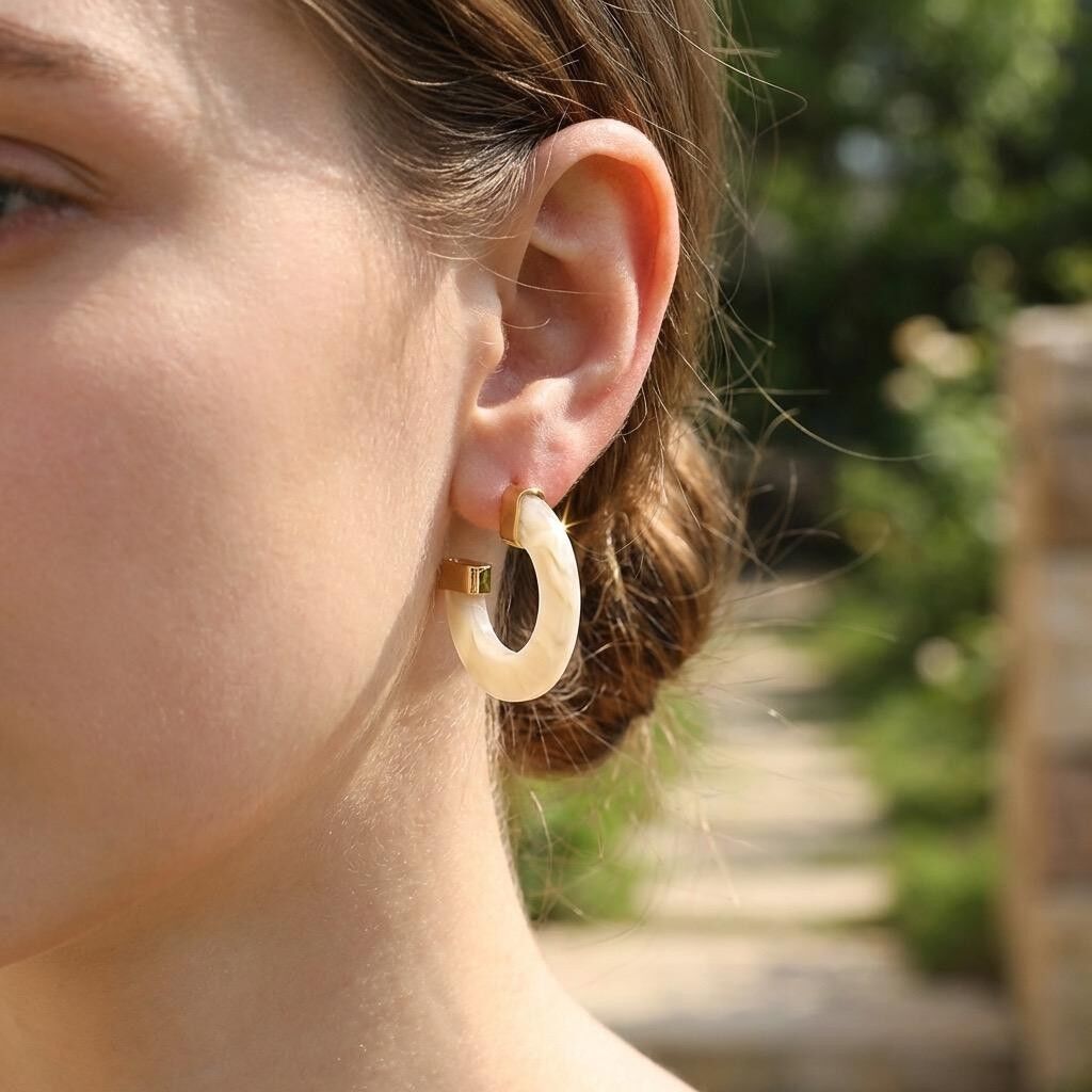Gold-plated, pearly resin half-hoop earrings
