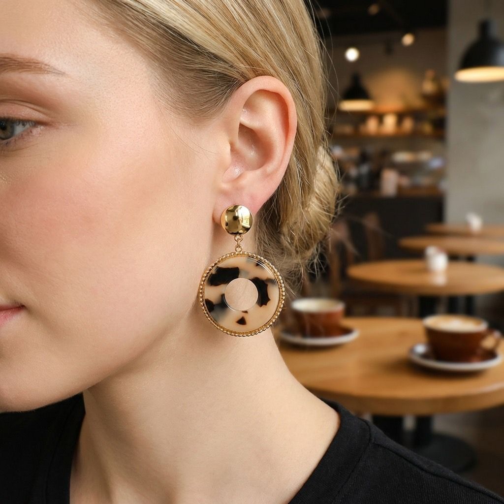 Gold-tone dangle earrings, leopard print resin circle