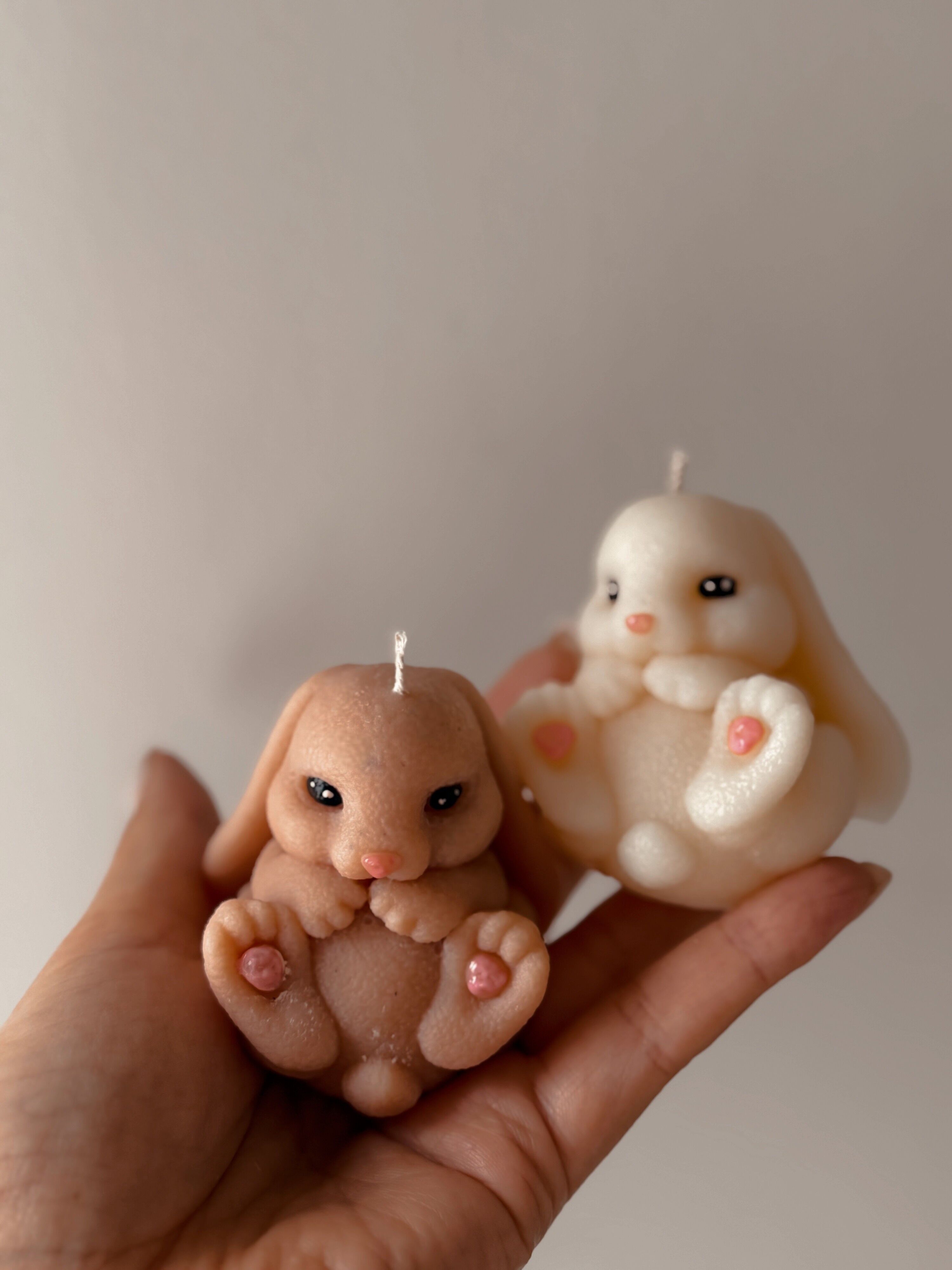 Handmade Rabbit Candle with paws in the air, available in various colors