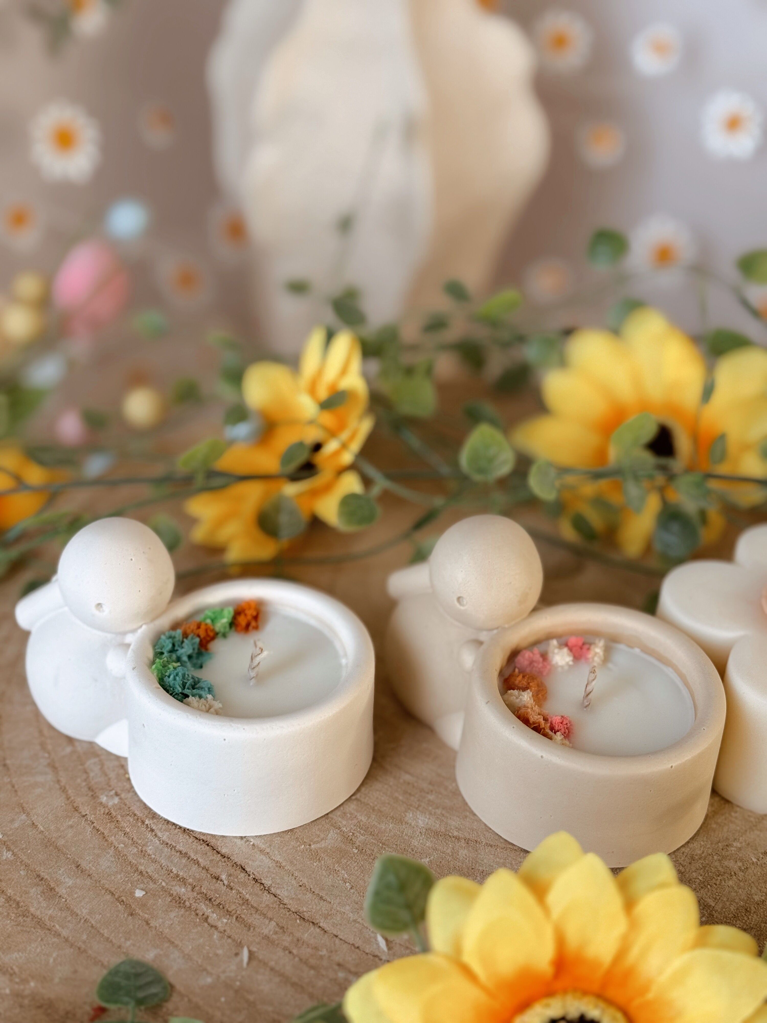 Handmade candle jar with a small rabbit made of jesmonite and dried flowers