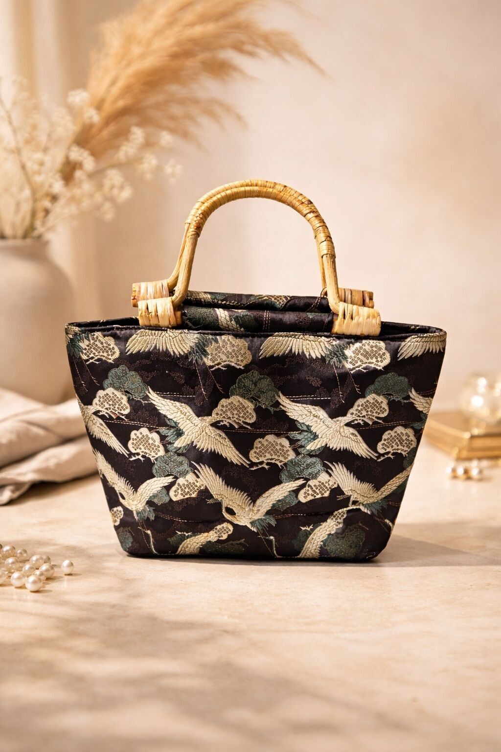 Elegant Mihella crane motif handbags with bamboo look handles