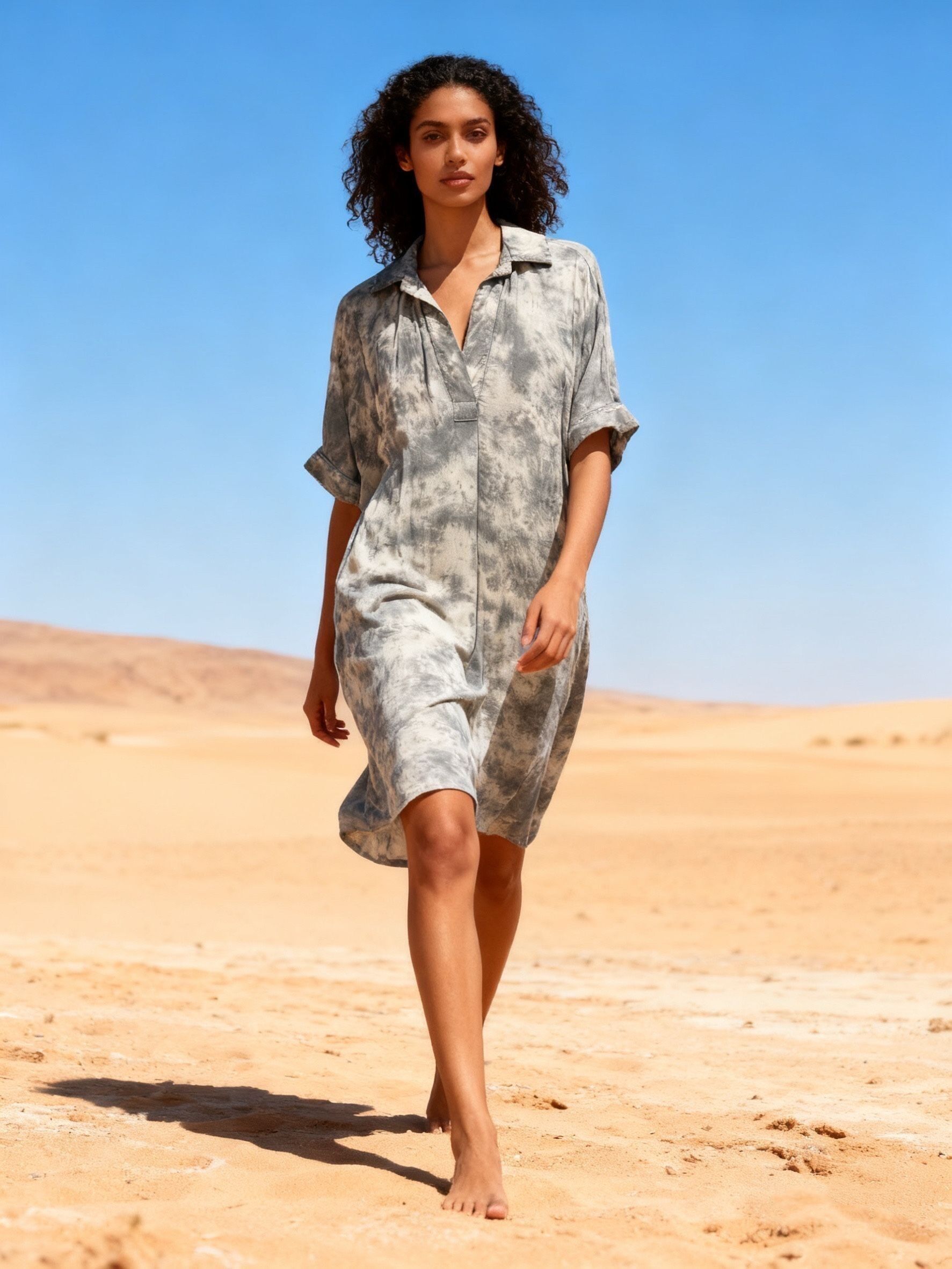 Long dress with embroidery on the back, V-neck, flared cut with invisible pockets