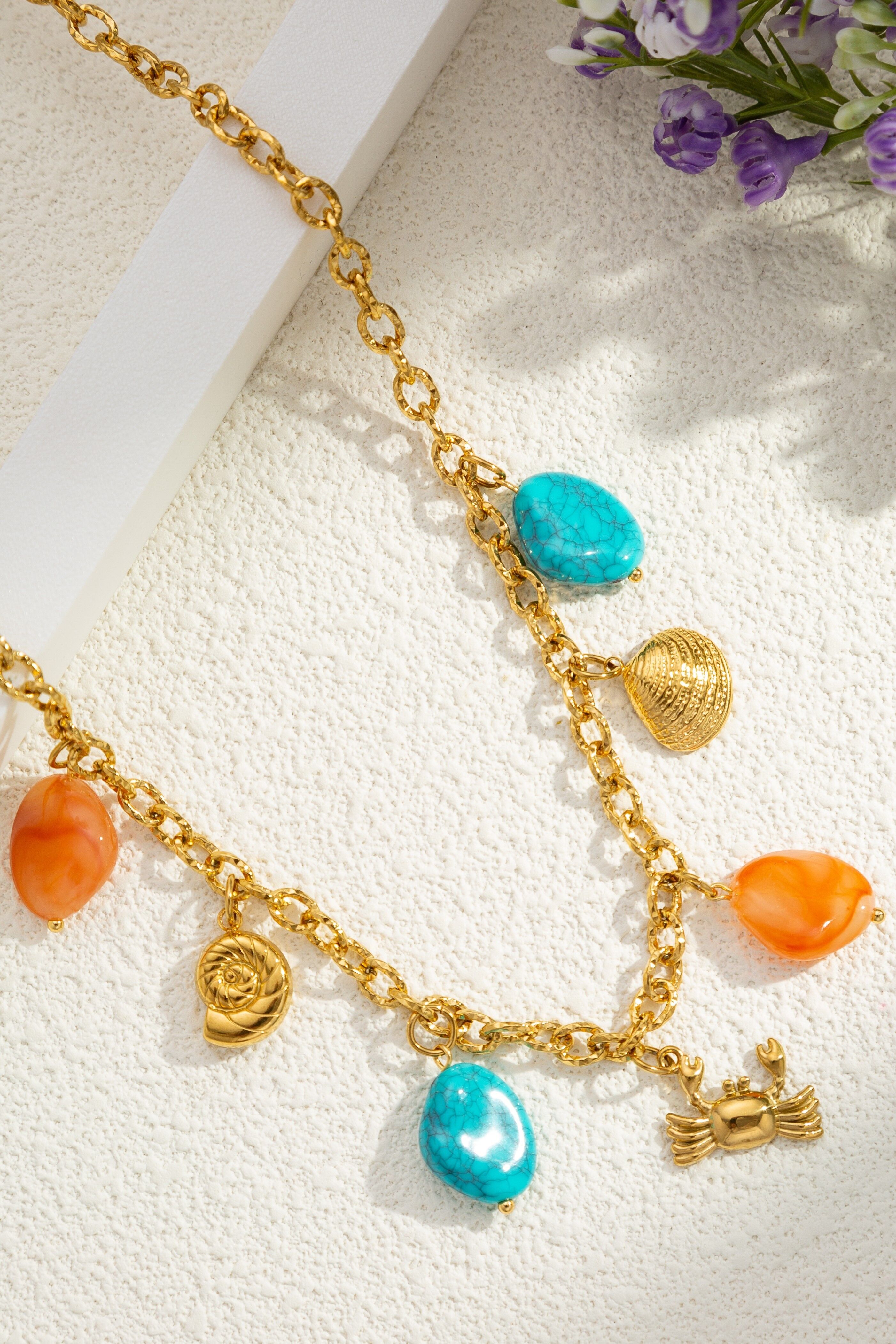Gold-tone stainless steel ocean charm necklace with turquoise and coral beads, Bohemian style